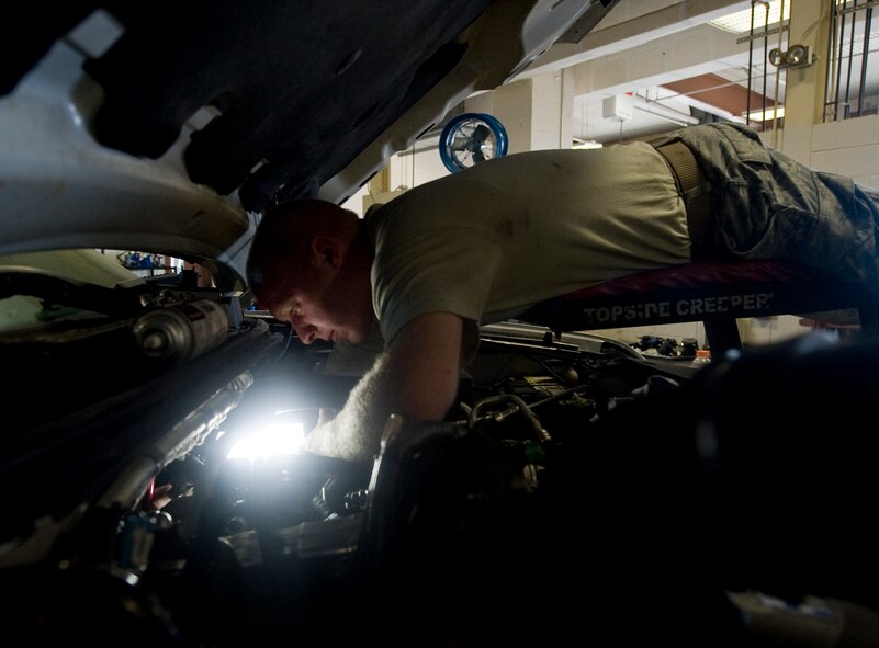 Staff Sgt. Edward Davis, 2nd Logistics Readiness Squadron Vehicle Maintenance Flight, repairs the turbo charger on a security forces patrol vehicle on Barksdale Air Force Base, La., Aug. 6. Vehicle maintenance Airmen inspect and service the entire fleet of government vehicles used by Team Barksdale, ranging from small passenger vehicles to heavy equipment such as forklifts. (U.S. Air Force photo/Staff Sgt. Chad Warren)(RELEASED)