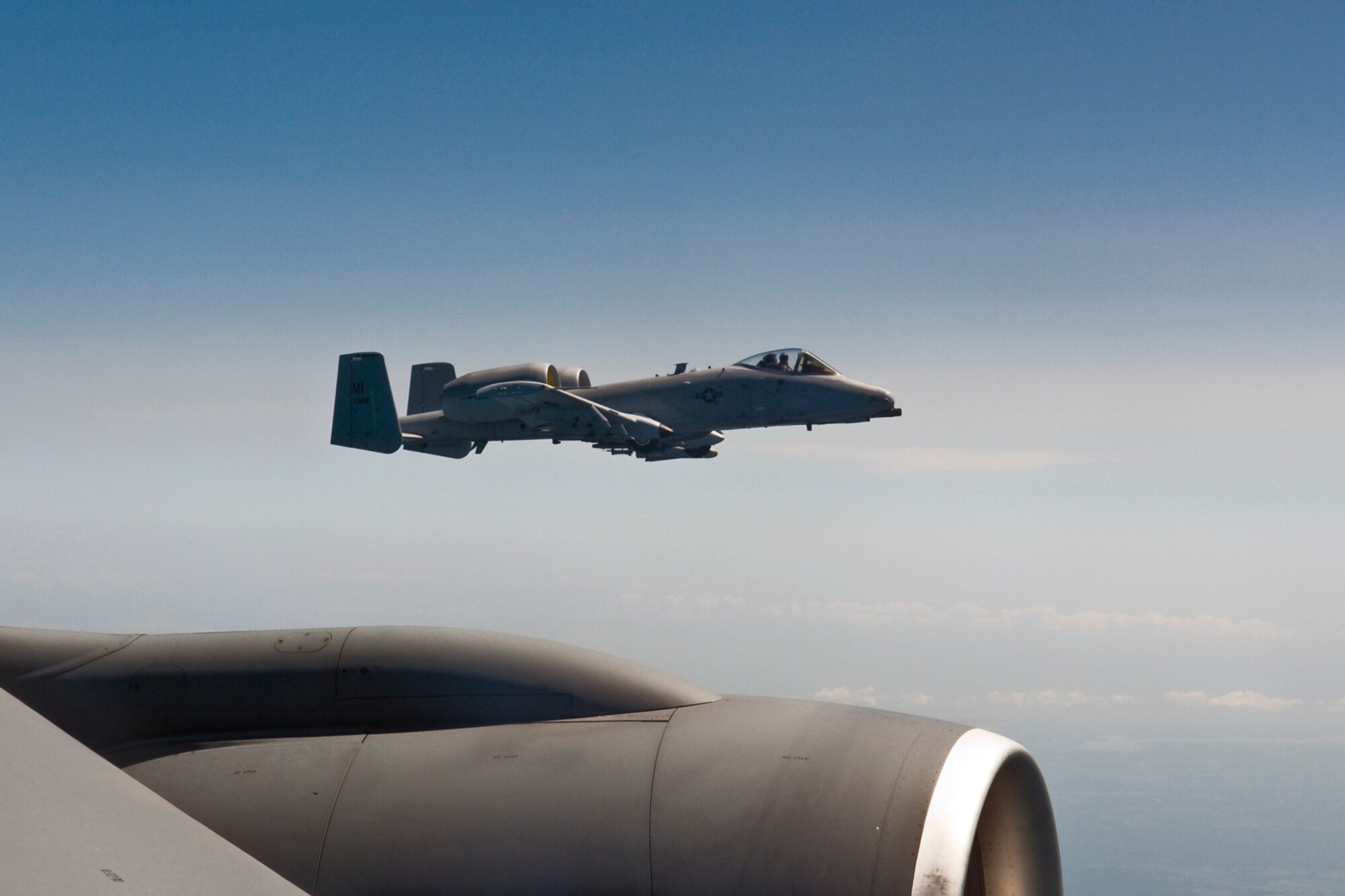 GRISSOM AIR RESERVE BASE, Ind.-- A KC-135R Stratotanker from the 434th Air Refueling Wing fly's side-by-side with an A-10 Thunderbolt II from the 127th Fight Wing Michigan Air National Guard during a refueling mission Aug. 1. The refueling mission gave crew members from both aircraft hands on training in aerial refueling to keep them ready for any mission around the globe. The mission also gave local media a chance to get up close and see a refueling mission take place. (U.S. Air Force photo/Senior Airman Jami K. Lancette)