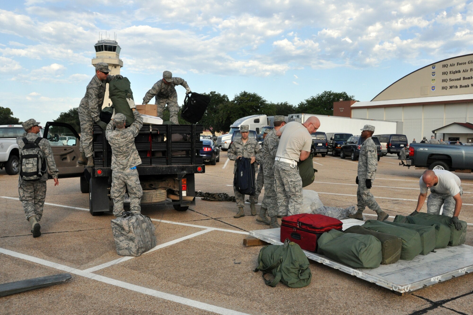 Chaplain Candidates assist Airmen from the 2nd Bomb Wing palletize luggage in the Hoban Hall parking lot at Barksdale Air Force Base, La., Aug. 2, 2012. Barksdale was the second stop for the 28 candidates as part of The Chaplain Candidate Intensive Internship, which is a program designed to provide a structured opportunity for students to test their call and suitability for service as Air Force chaplains. The candidates were at Barksdale from July 27 to Aug 2, 2012. The CCII program exposes the candidates to what the Air Force is all about. (U.S. Air Force photo by Master Sgt. Jeff Walston)
