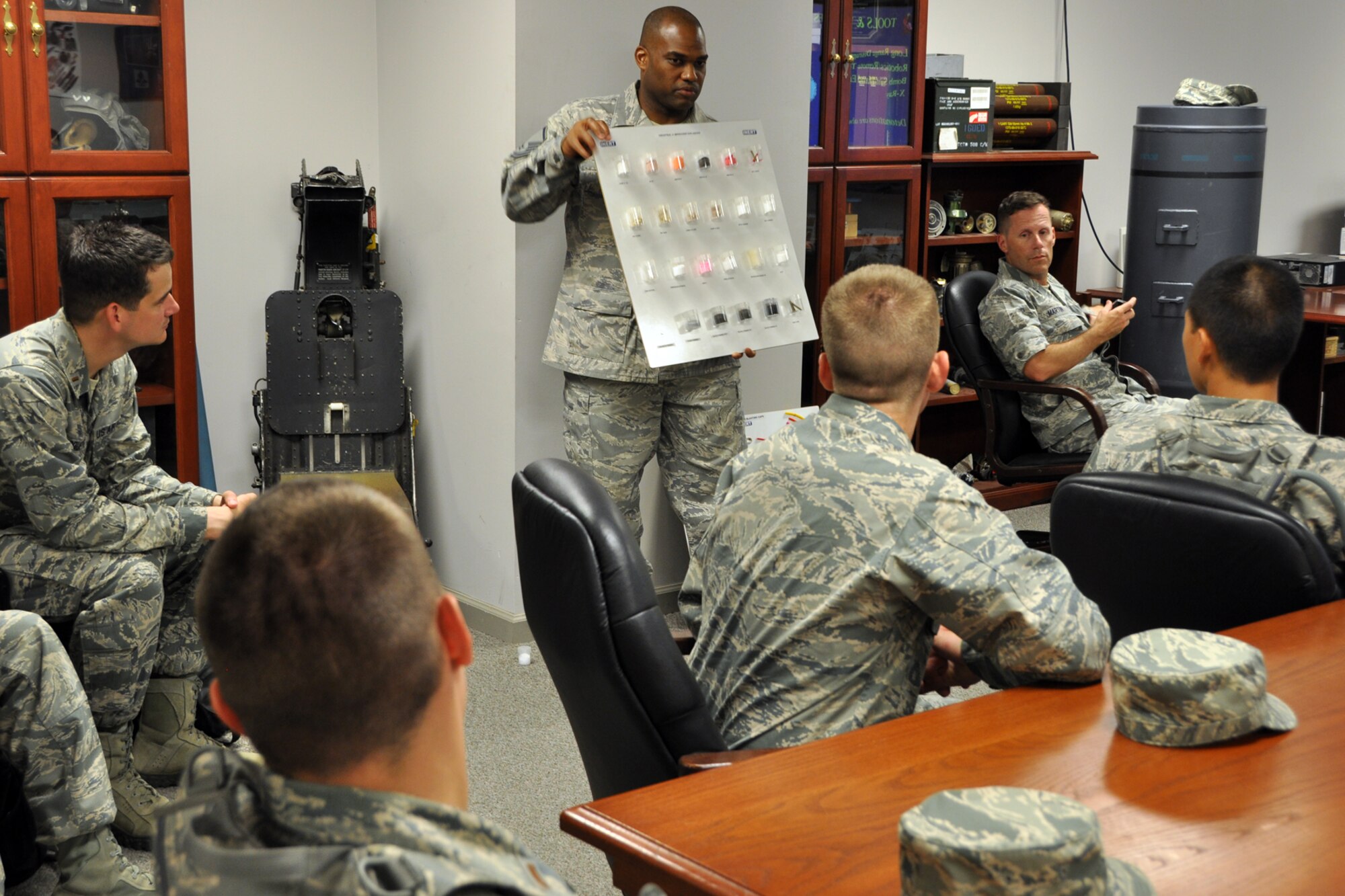 Master Sgt. James Martin, an explosive ordinance disposal technician, displays many different kinds of inert explosive examples to a group of Chaplain Candidates during their tour of the EOD facilities at Barksdale Air Force Base, La. July 31, 2012. A tour of the fire department was part of The Chaplain Candidate Intensive Internship program’s visit to Barksdale from July 27 to Aug 2, 2012. (U.S. Air Force photo by Master Sgt. Jeff Walston)