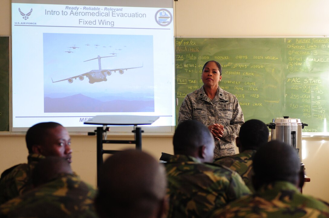 THEBEPHATSWA AIR BASE, Botswana – U.S. Air National Guard Lt. Col. June Oldman, MEDLITE 12 mission director, speaks to members of the Botswana Defense Force prior to classroom instruction Aug. 6, 2012. MEDLITE is an annual exercise bringing together U.S. forces personnel with counterparts from militaries throughout Africa. The goal of the exercise is to enhance capabilities and work together by introducing the U.S. Aeromedical Evacuation system of patient movement to the BDF military personnel. (U.S. Air Force photo/Senior Airman Lausanne Morgan)