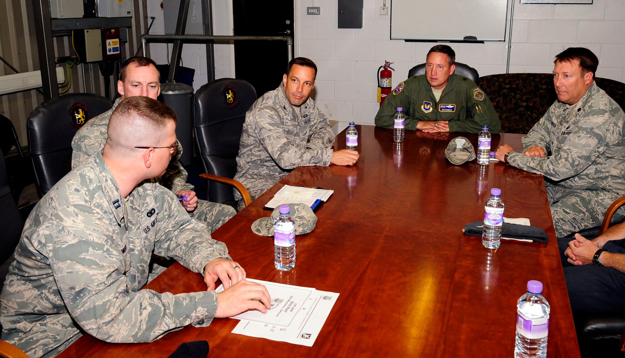 RAF MILDENHALL, England – Brig. Gen. Jon Norman, Director to United States Air Forces in Europe-United Kingdom, is briefed on 100th Security Forces operations during a tour to RAF Mildenhall Aug. 6, 2012. The brief familiarized Norman with security forces’ day-to-day routine and how they work with both local authorities and the Ministry of Defence Police assigned here. (U.S. Air Force photo/Senior Airman Ethan Morgan)
