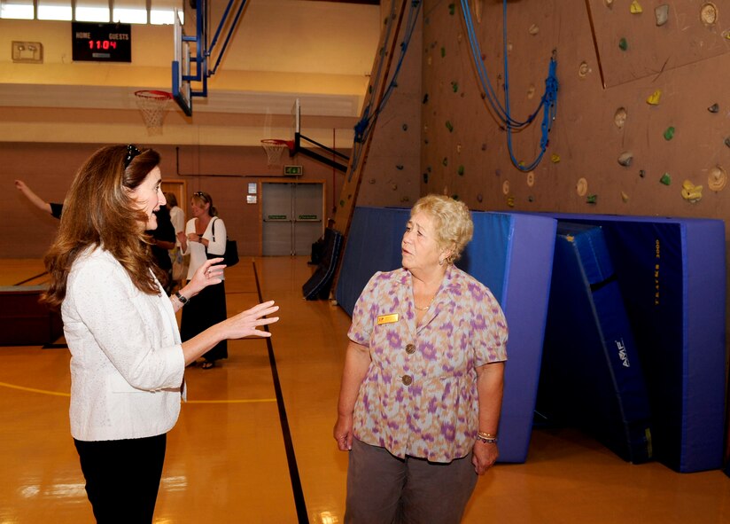 RAF MILDENHALL, England –Kim Norman, wife of Brig. Gen. Jon Norman, Director to United States Air Forces in Europe-United Kingdom, speaks with Joan Goode, 100th Force Support Squadron Youth Center director, during a tour of the facility at RAF Mildenhall Aug. 6, 2012. (U.S. Air Force photo/Senior Airman Ethan Morgan)