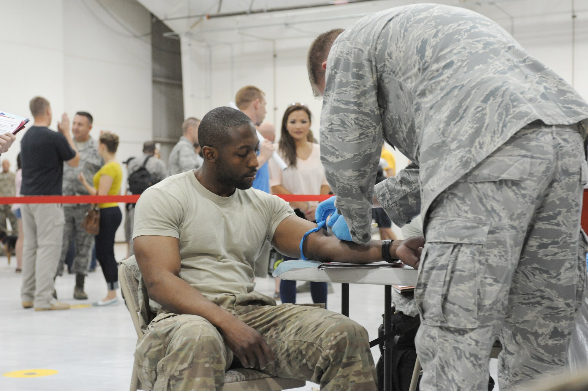 U. S. Air Force Airman 1st Class Jerome Leach, 27th Special Operations Communications Squadron cyber surety technician, prepares for vaccination during Operation Homecoming at Cannon Air Force, N.M., Aug. 4, 2012. Operation Homecoming is a monthly event that reunites Cannon's Air Commandos with their loved ones. (U.S. Air Force photo/Airman 1st Class Xavier Lockley)