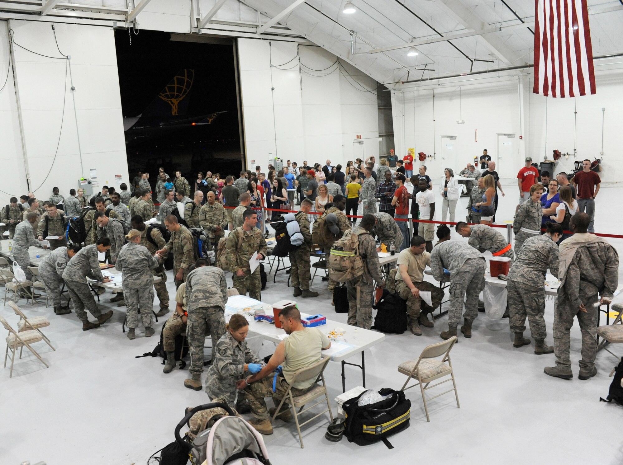 Air Commandos from the 27th Special Operations Wing go through the redeployment line during Operation Homecoming at Cannon Air Force Base, N.M., Aug. 4, 2012. Operation Homecoming is a monthly event that reunites Cannon's Air Commandos with their loved ones. (U.S. Air Force photo/Airman 1st Class Xavier Lockley)