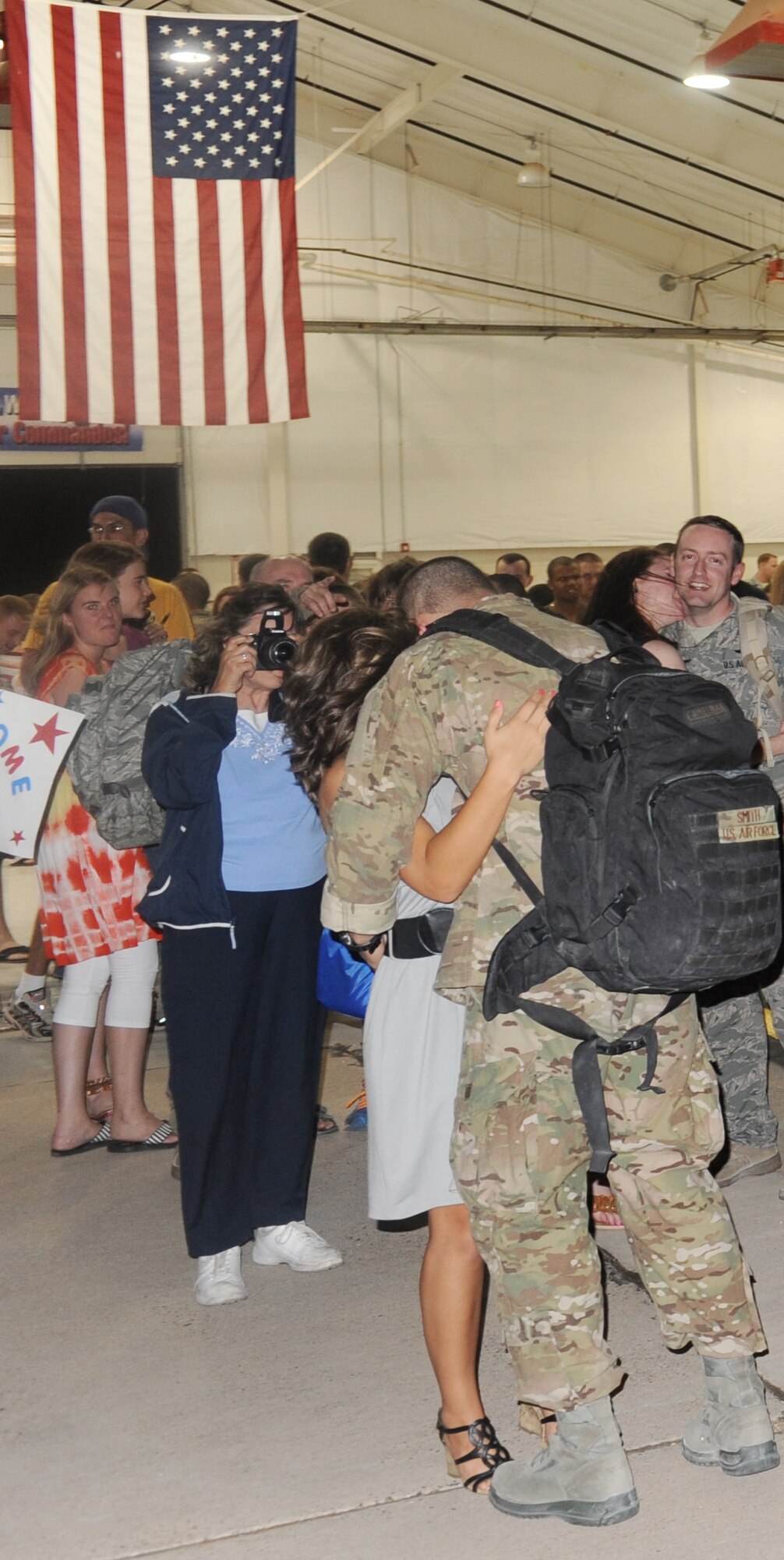 Air Commandos returning from deployment were welcomed home by 27th Special Operations Wing leadership, family members and friends during Operation Homecoming at Cannon Air Force Base, N.M., Aug. 4, 2012. Operation Homecoming is a monthly event that reunites Cannon's Air Commandos with their loved ones. (U.S. Air Force photo/Airman 1st Class Xavier Lockley)