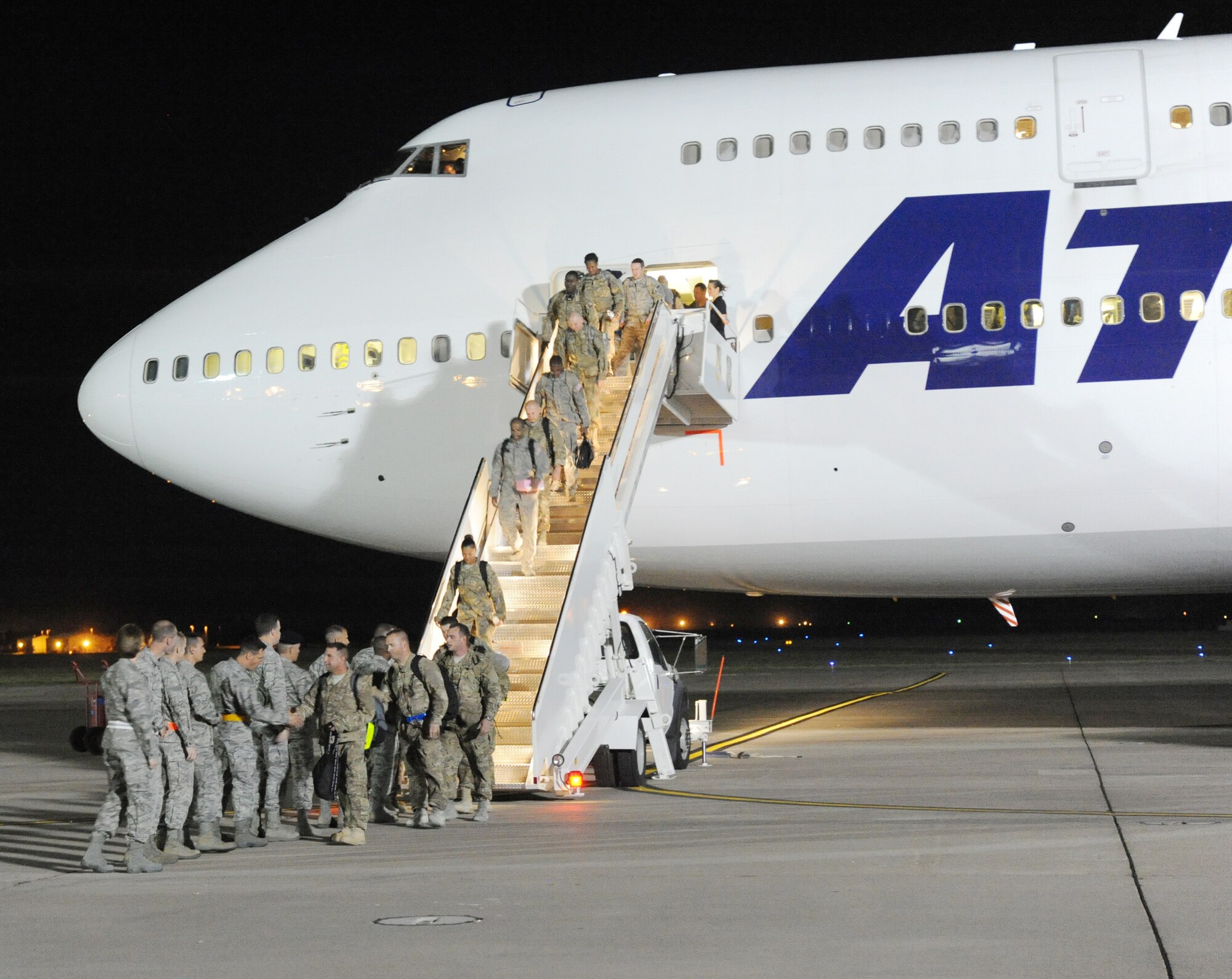 Air Commandos returning from deployment were welcomed home by 27th Special Operations Wing leadership, family members and friends during Operation Homecoming at Cannon Air Force Base, N.M., Aug. 4, 2012. Operation Homecoming is a monthly event that reunites Cannon's Air Commandos with their loved ones. (U.S. Air Force photo/Airman 1st Class Xavier Lockley)