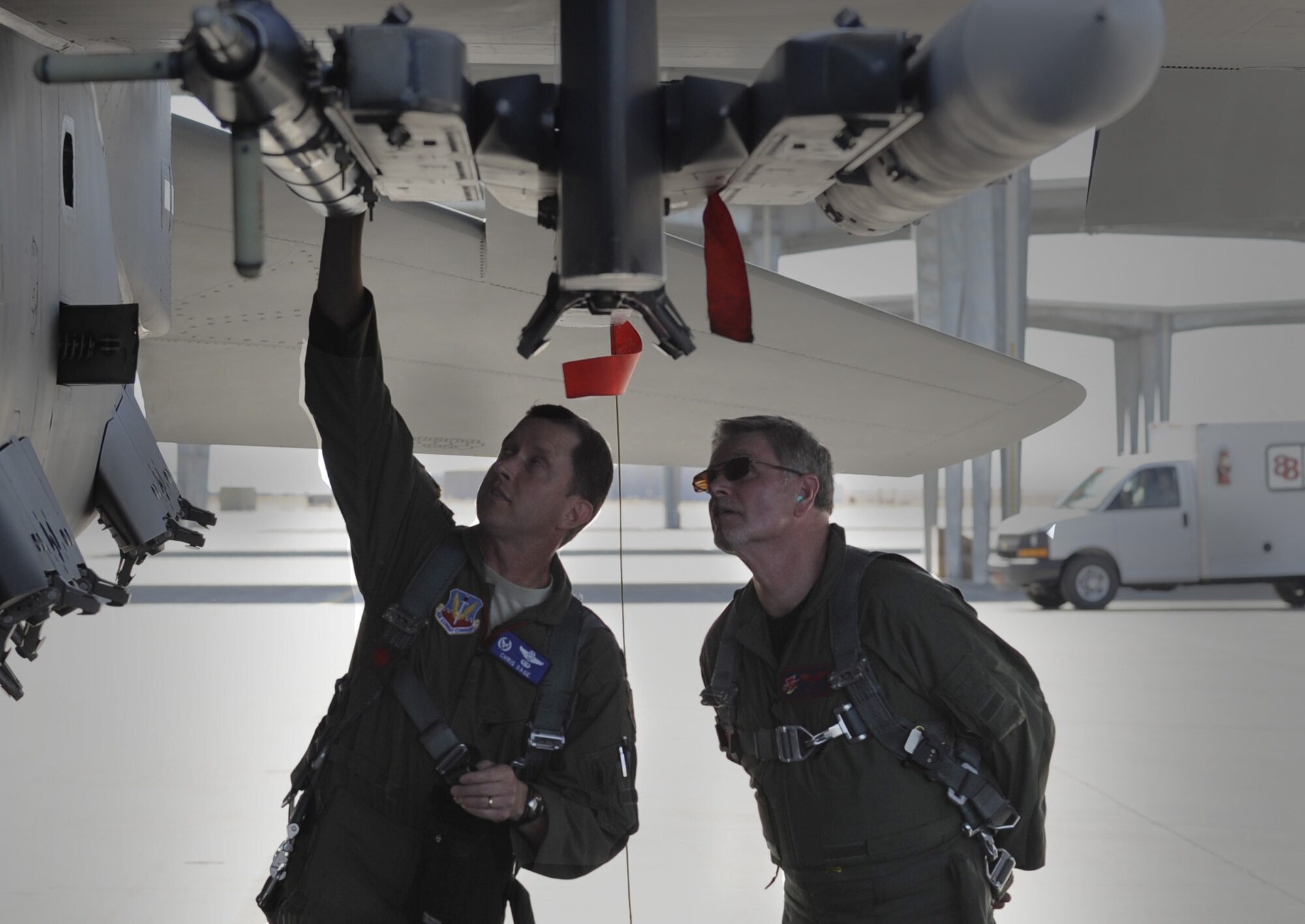 U.S. Air Force Col.  Christopher Sage, 366th Operations Group commander, conducts a preflight inspection on an F-15E Strike Eagle with Byron Schmidt, airspace manager, prior to the first flight in the Mountain Home Range Complex’s new airspace and Mr. Schmidt’s orientation flight at Mountain Home Air Force Base, Idaho, July 24, 2012. The expansion will accommodate the technological advancements of modern aircraft and meet current and future training requirements for the F-15E Strike Eagle. (U.S. Air Force photo/2nd. Lt. Bryant Davis)