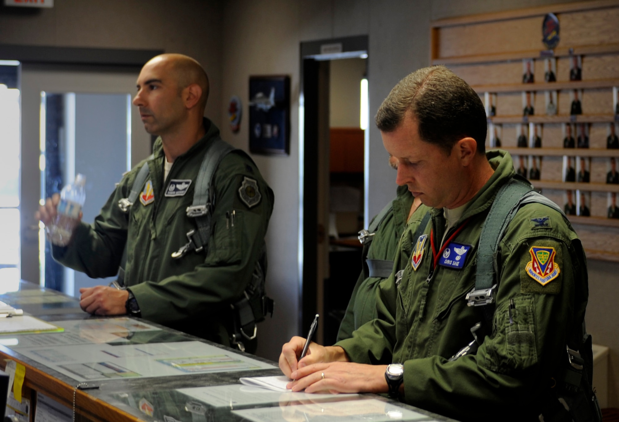 U.S. Air Force Col.  Christopher Sage, 366th Operations Group commander, and Lt. Col. Damon Anthony, 366th Operations Support Squadron commander, receive a pre-brief prior to their first flight in the Mountain Home Range Complex’s new airspace July 26, 2012, at Mountain Home Air Force Base, Idaho. The expansion will accommodate the technological advancements of modern aircraft and meet current and future training requirements for the F-15E Strike Eagle. (U.S. Air Force photo/2nd. Lt. Bryant Davis)