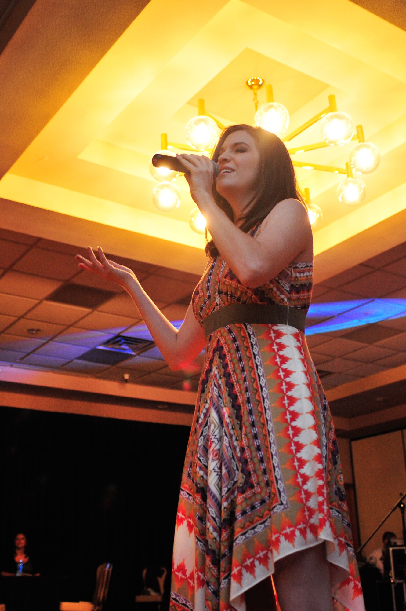 U.S. Air Force Senior Airman Jette Carr, 27th Special Operations Wing Public Affairs, showcases vocal talent during the Cannon Idol competition at The Landing Zone at Cannon Air Force Base, N.M., Aug. 4, 2012. Carr took home second place and $200 in prize money.  (U.S. Air Force photo/Airman 1st Class Alexxis Pons Abascal) 