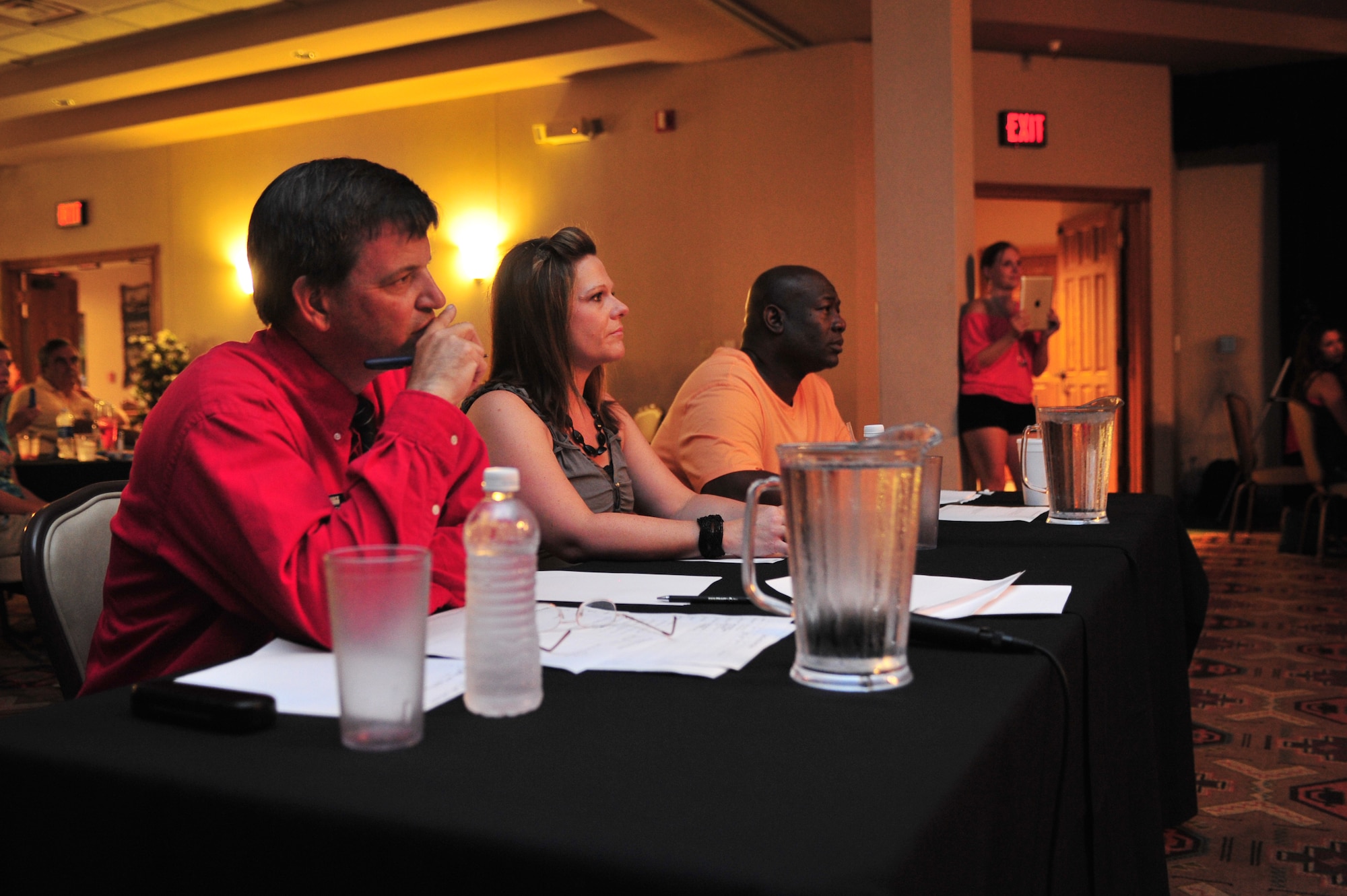 Judges for Cannon Idol critique a performer at The Landing Zone at Cannon Air Force Base, N.M., Aug. 4, 2012. Air Commandos within the 27th Special Operations Wing showcased their vocal abilities to a room full of supporters in an effort to take home first place and claim the title of Cannon?s best vocalist. (U.S. Air Force photo/Airman 1st Class Alexxis Pons Abascal) 