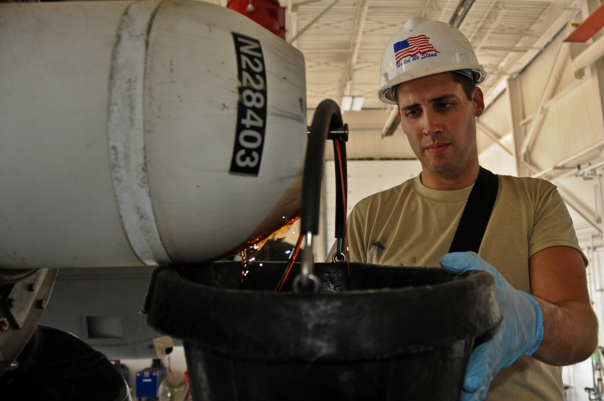 Staff Sgt. Brian Connelly, 911th Airlift Wing maintenance squadron aerospace propulsion mechanic, drains hydraulic fluid from the dome of a C-130 Hercules’ T56-15 engine before replacing the domes seals, here, July 31, 2012. The engine dome controls the pitch of the engine propeller blades which ensures that the blade movement creates only a positive impact on the flight of the aircraft. The seals must be replaced after every 2,000 hours of flying time to safeguard mission readiness. (U.S. Air Force photo by Senior Airman Joshua J. Seybert)