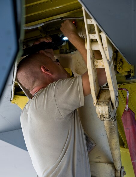 Tech. Sgt. Jason Gamble, 96th Aircraft Maintenance Unit hydraulic specialist, inspects the tip gear of a B-52H Stratofortress on Barksdale Air Force Base, La., Aug. 3. The combined efforts of the 2nd Maintenance Group units resulted in July being the most successful maintenance month here in 16 years.  (U.S. Air Force photo/Staff Sgt. Chad Warren)(RELEASED)