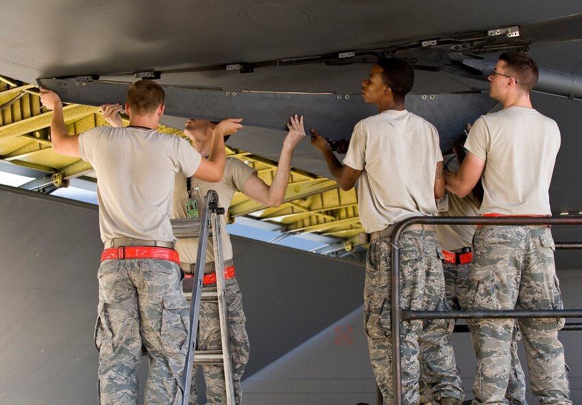 Airmen from the 96th Aircraft Maintenance Unit remove an aft engine nacelle faring from a B-52H Stratofortress on Barksdale Air Force Base, La., Aug. 3. The combined efforts of the 2nd Maintenance Group units resulted in July being the most successful maintenance month here in 16 years. (U.S. Air Force photo/Staff Sgt. Chad Warren)(RELEASED)