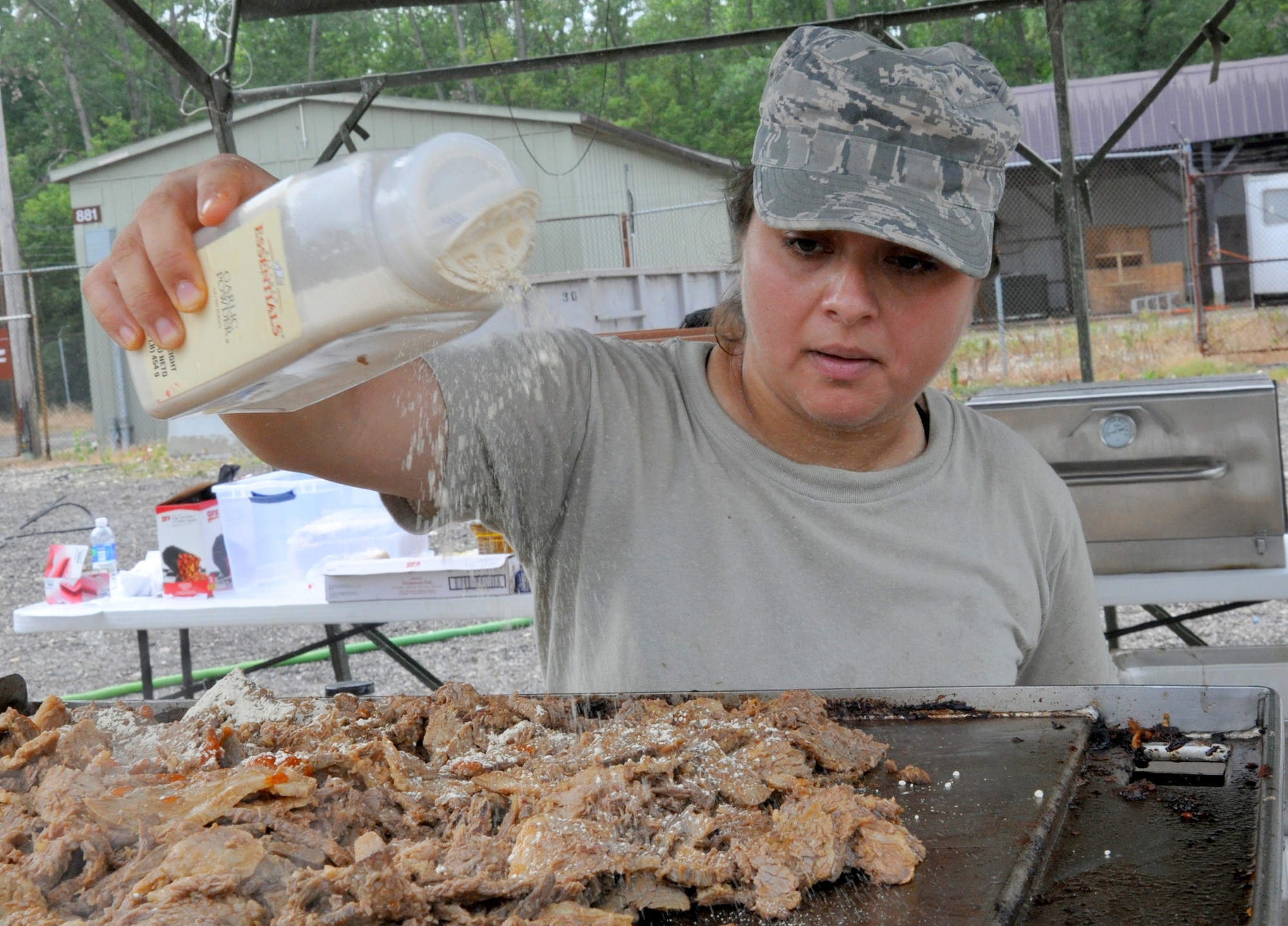 WRIGHT-PATTERSON AIR FORCE BASE, Ohio - Tech. Sgt. Alexandra Holmes, 445th Services Sustainment Flight journeyman, prepares lunch during the Hennessy Award competition July 14. (U.S. Air Force photo/Master Sgt. Charlie Miller)