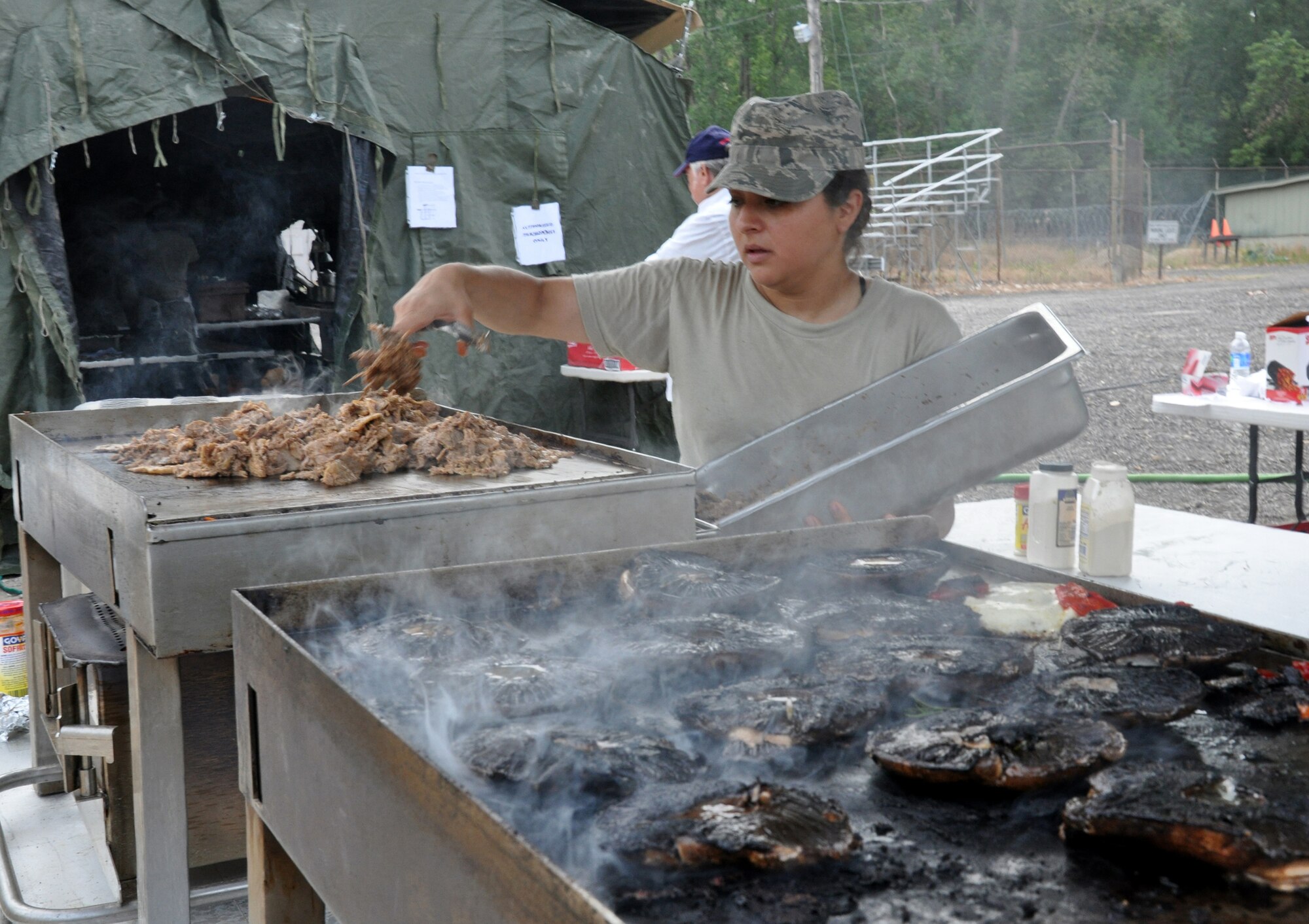 WRIGHT-PATTERSON AIR FORCE BASE, Ohio - Tech. Sgt. Alexandra Holmes, 445th Services Sustainment Flight journeyman, prepares lunch during the Hennessy Award competition July 14. (U.S. Air Force photo/Master Sgt. Charlie Miller)