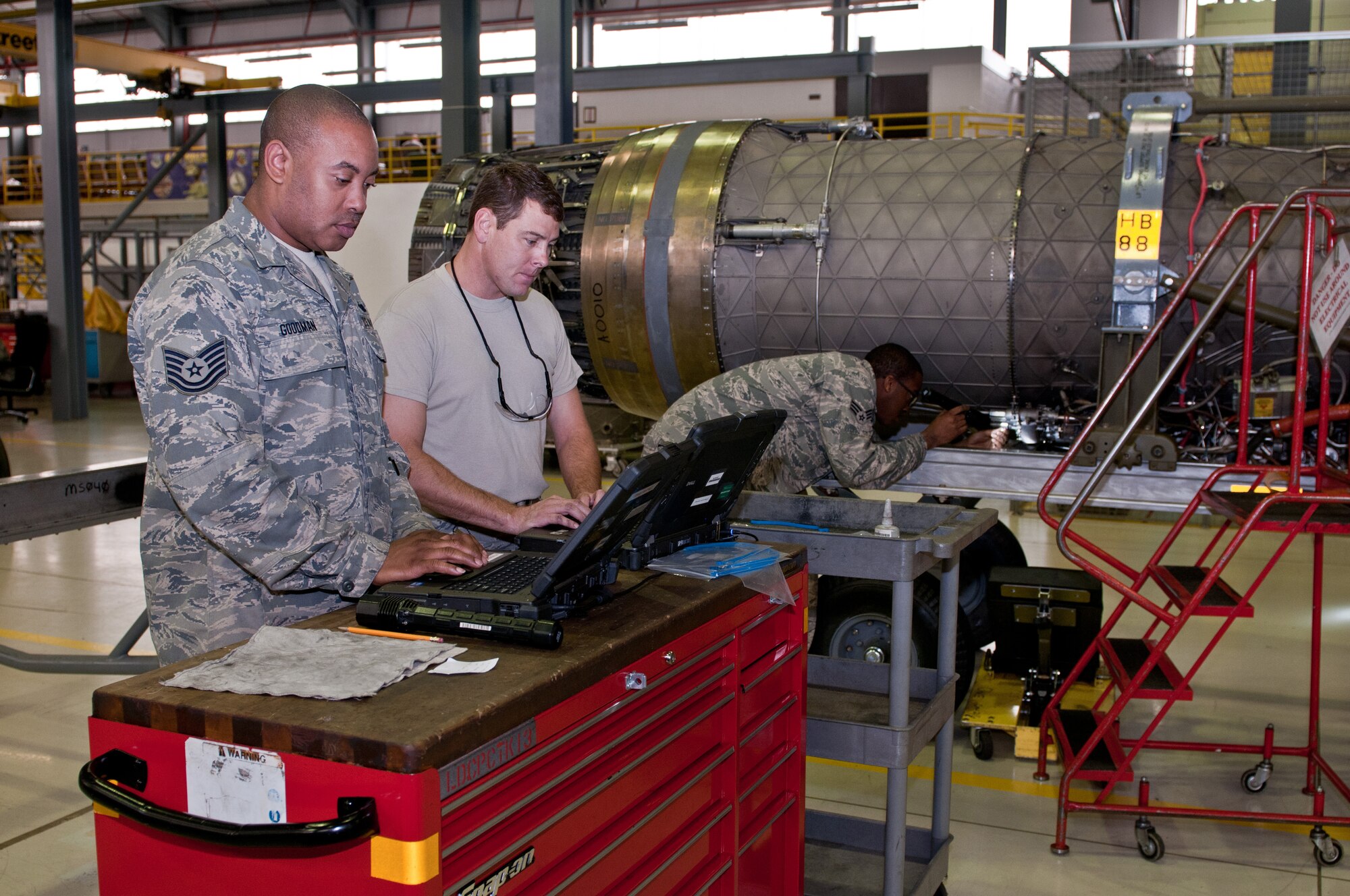 ROYAL AIR FORCE LAKENHEATH, England -- Tech. Sgt. Cory Goodman (left), Staff Sgt. Charlie Warfle (middle) and Senior Airman Justin White, aerospace propulsion maintainers from the 169th Fighter Wing, McEntire Joint National Guard Base, S.C., work final inspections on a PW-229 F-15 engine inside the 48th Component Maintenance Squadron hangar August 2, 2012.  The 169th FW maintainers are here in support of their unit, which is currently deployed to Afghanistan.  (U.S. Air Force photo by Senior Airman Connor Estes)