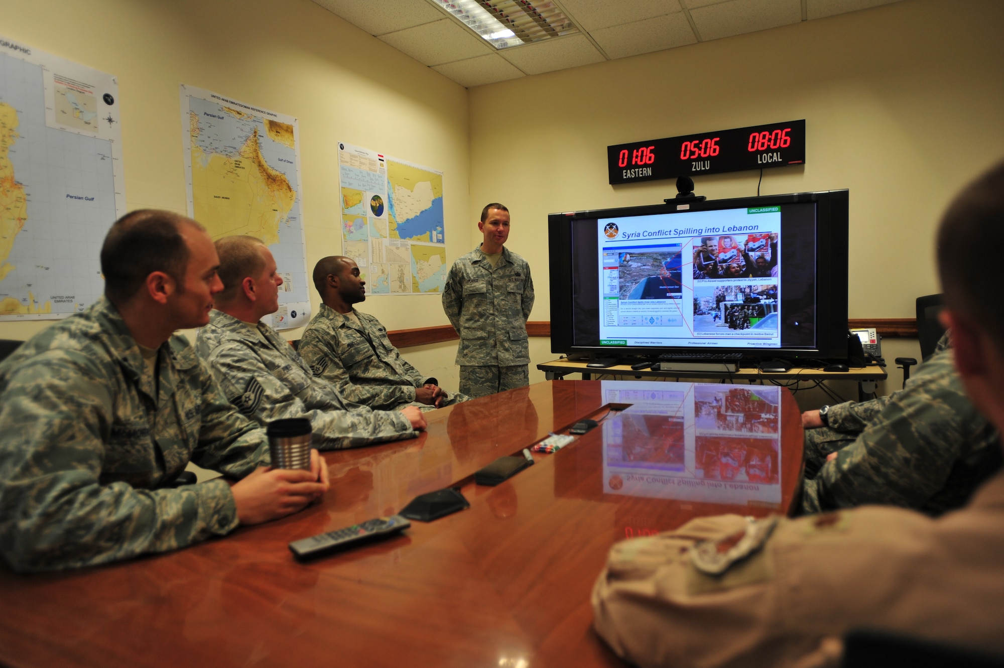 U.S. Air Force Staff Sgt. Wade Pearce, 379th Expeditionary Operations
Support Squadron combat integration capability analyst, briefs team members
on current events within the 379th Air Expeditionary Wing area of
responsibility, Southwest Asia, August 4, 2012. Wade is deployed from Dyess
Air Force Base, Texas and a native of Grant Pass, Ore. (U.S. Air Force
photo/Staff Sgt. Sheila deVera)
