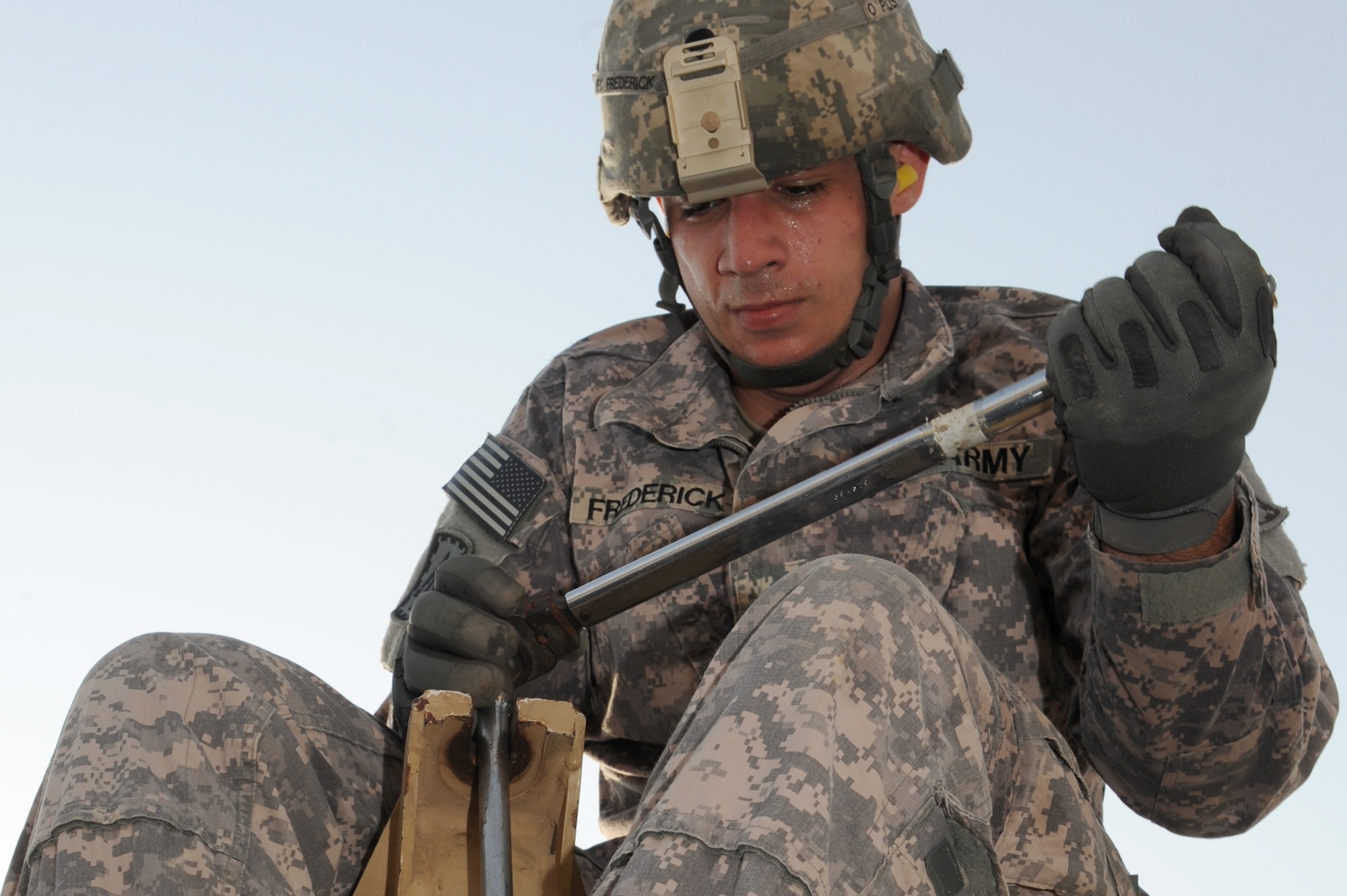 SOUTHWEST ASIA - U.S. Army Spc. Daniel Frederick, crane operator, fits a ratchet on a pole during a missile reload certification Aug. 4, 2012. Frederick is part of the 1st Battalion, 7th Air Defense Artillery Regiment deployed from Fort Bragg, N.C.  (U.S. Air Force photo/Master Sgt. Scott MacKay)