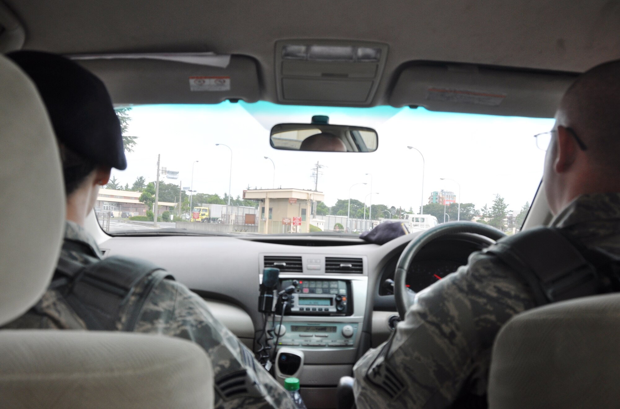 YOKOTA AIR BASE, Japan -- Senior Airman Madeline Salton, left, 374th Security Forces Squadron patrolman, and partner Staff Sgt. Lucas McLean, 374 SFS base defense operations controller, patrol the base looking for traffic and parking code violations Aug. 2, 2012 at Yokota Air Base, Japan. Patrolmen spend much of their time contributing to the safety of base residents by performing routine traffic stops and responding to 911 dispatch calls. (U.S. Air Force photo by Senior Airman Katrina R. Menchaca)
