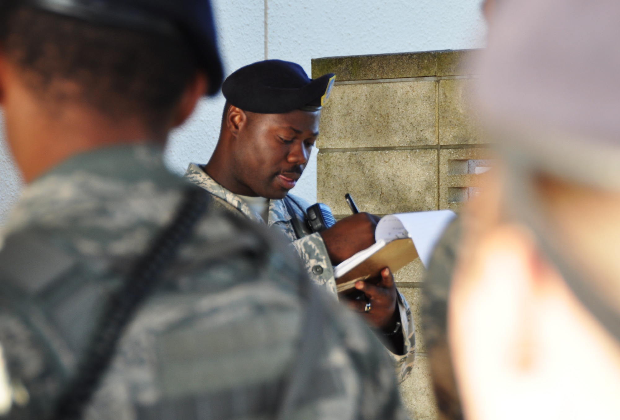 YOKOTA AIR BASE, Japan -- Master Sgt. Edward Johnson, 374th Security Forces Squadron alpha flight chief, briefs about the following work day as well as upcoming events on base during guard mount Aug. 2, 2012 at Yokota Air Base, Japan. Guard mount is preformed at the beginning and end of every shift to help the flight know about important information which will help protect the base. (U.S. Air Force photo by Senior Airman Katrina R. Menchaca)
