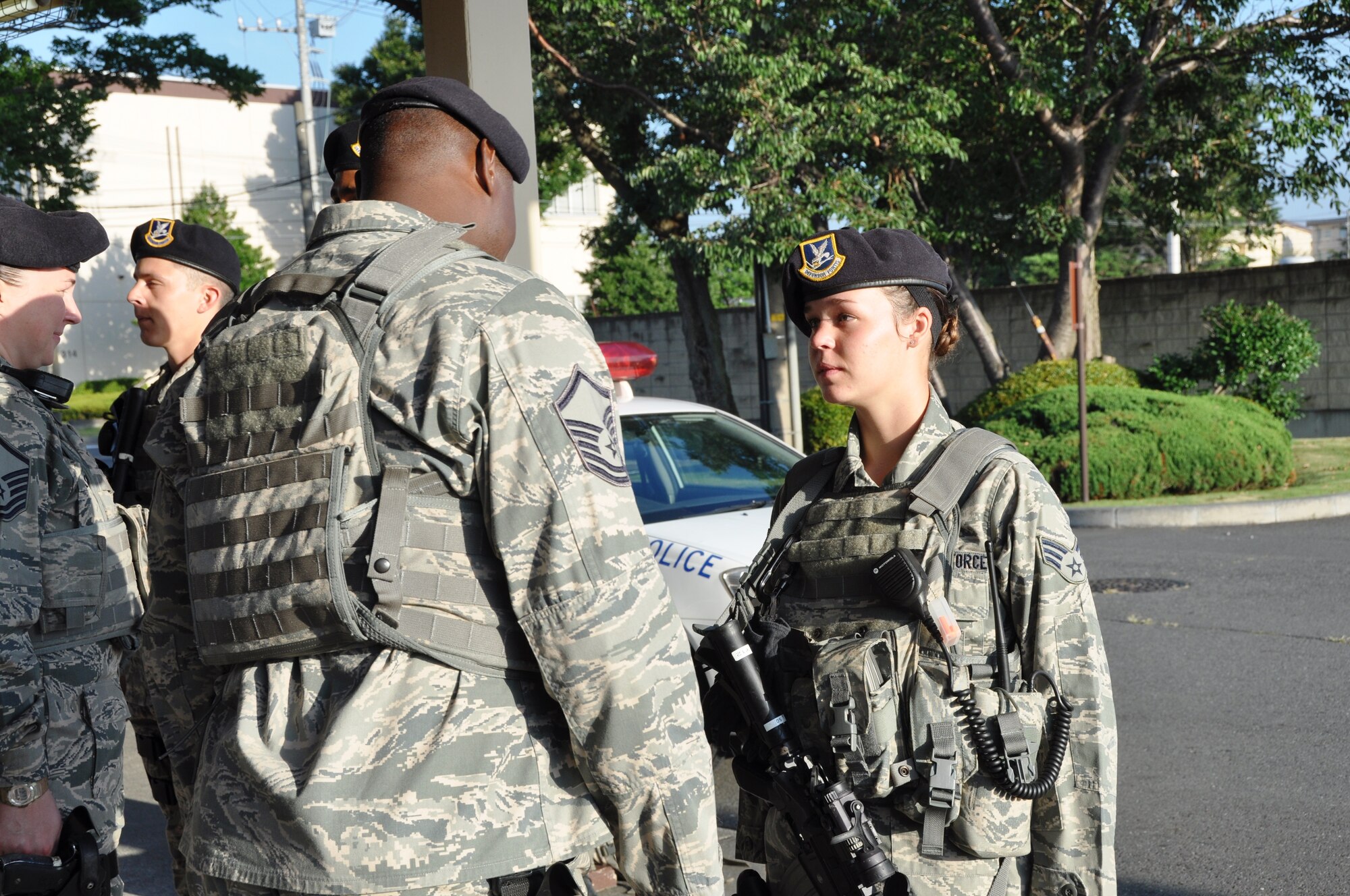 YOKOTA AIR BASE, Japan -- Senior Airman Madeline Salton, right, 374th Security Forces Squadron patrolman, has her uniform inspected by Master Sgt. Edward Johnson, 374 SFS alpha flight chief, during an open ranks inspection Aug. 2, 2012 at Yokota Air Base, Japan. Security Forces Airmen perform open ranks inspections at the beginning of every shift to ensure that each member has appropriate gear and presents a professional appearance. (U.S. Air Force photo by Senior Airman Katrina R. Menchaca)