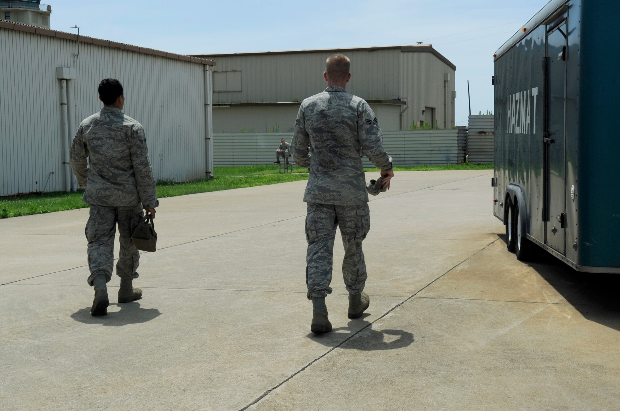 Airman 1st Class Joseph Pandolfo, left, 8th Communications Squadron client systems technician, and Senior Airman Joshua McMaster, right, 8th CS CST, head out to find the location of a work order request, July 26, 2012, on Kunsan Air Base, Republic of Korea. Requests are now submitted through the Air Force’s new Enterprise Service Desk located at Lackland Air Force Base, Texas. (U.S. Air Force photo/Senior Airman Jessica Hines) 