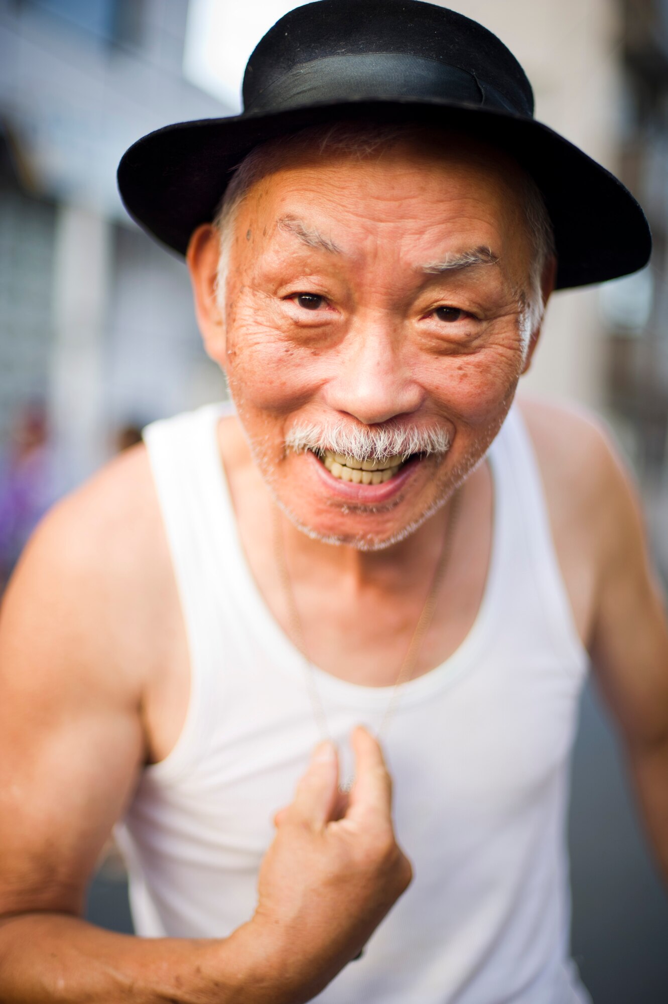 FUSSA CITY, Japan -- A Japanese man poses for a photo during the Tanabata Festival in Fussa City, Japan, on Aug. 3, 2012. This year marked the 62nd annual Tanabata Festival in Fussa. The festival included several parades as well as street vendors selling a variety of traditional Japanese festival foods.  (U.S. Air Force photo by Staff Sgt Stacy Moless) 