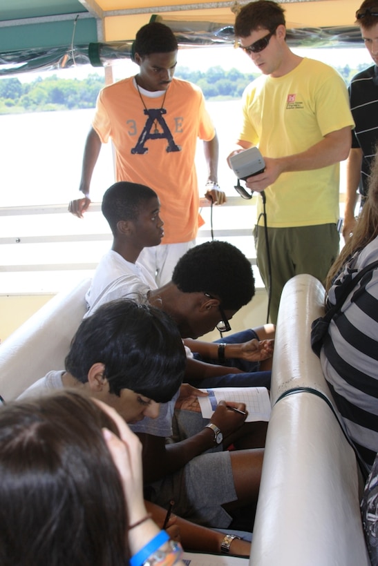 SAVANNAH, Ga. — Jason Lavecchia, a hydraulic engineer with the U.S. Army Corps of Engineers Savannah District, shows a class of Jenkins High School students how to read measurements taken by a water quality probe in the Savannah Harbor, July 25, 2012.