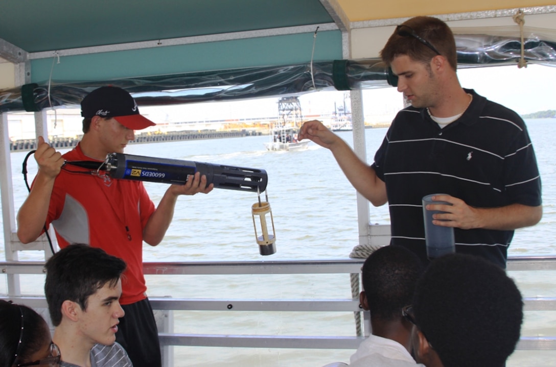 SAVANNAH, Ga. — Bryan Robinson, a hydraulic engineer with the U.S. Army Corps of Engineers Savannah District, shows a class of Jenkins High School students how to use a water quality probe to measure dissolved oxygen and salinity levels in the Savannah Harbor, July 25, 2012.