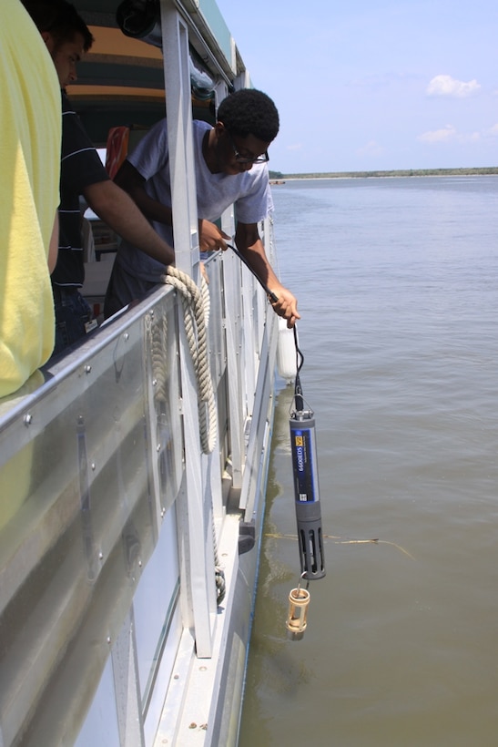 SAVANNAH, Ga. — A Jenkins High School student lowers a water quality probe into the Savannah Harbor during a boat tour hosted by the U.S. Army Corps of Engineers Savannah District, July 25, 2012.