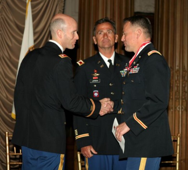 New Philadelphia District Commander Lt. Col. Chris Becking (left) thanks outgoing commander Lt. Col. Philip Secrist (right) during the Change of Command ceremony June 26th. North Atlantic Division Commander Christopher J. Larsen (center) presided over the ceremony.