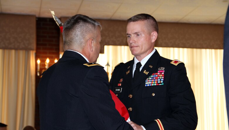 U.S. Army Corps of Engineers Deputy Commander and Deputy Chief of Engineers Maj. Gen. Todd T. Semonite hands the flag of the U.S. Army Corps of Engineers North Atlantic Division to incoming commander Col. Kent D. Savre at an Assumption of Command ceremony July 31 at the Fort Hamilton Community Club in Brooklyn. Savre most recently served as Director, Office of the Chief of Engineers in the Pentagon. 