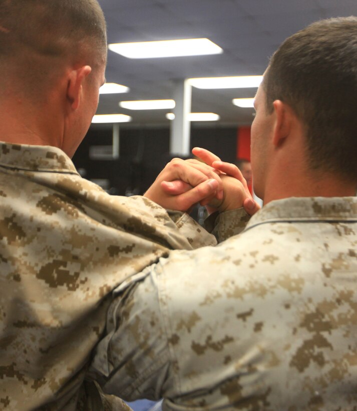 Petty Officer 3rd Class Michael J. Sency (right), a religious program specialist with 2nd Marine Logistics Group, practices a wrist-lock technique with Cpl. Adams Sable, a fellow student, during a Marine Corps Martial Arts Program Instructor course aboard Camp Geiger, N.C., July 26, 2012.  The course included 100 hours of instruction and grueling practical application in a fast-paced training environment.  Sency graduated the course aboard Camp Geiger, N.C., Aug. 1, 2012. Sency is now part of a very small group of RPs who are qualified to teach Marine Corps Martial arts.