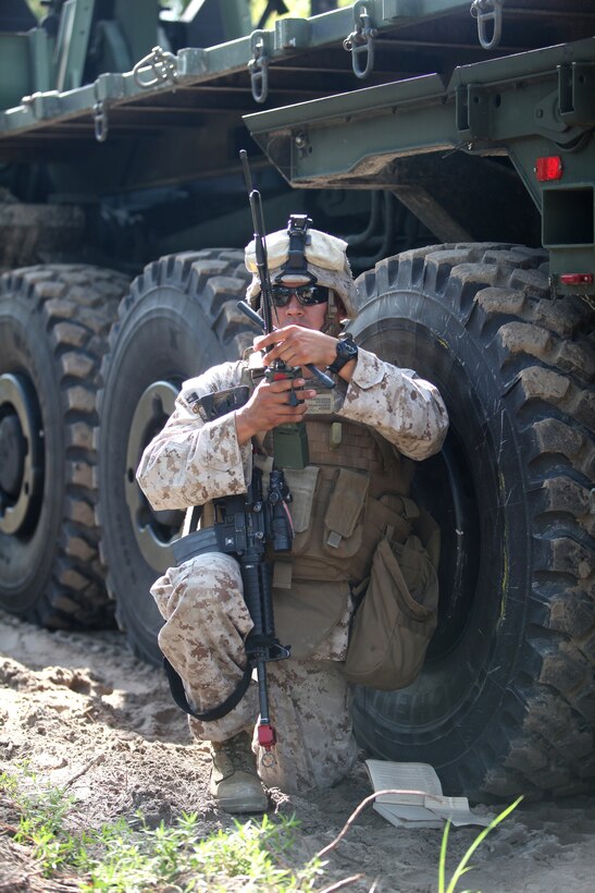 Sgt. Emerson C. Mason, a motor vehicle operator with Combat Logistics Battalion 8, 2nd Marine Logistics Group, reports his situation to the convoy commander after his truck hit a simulated improvised explosive device during a field training exercise aboard Camp Lejeune, N.C., Aug. 1, 2012.  During the week-long exercise, troops faced many challenges such as simulated firefights, explosions and casualty evacuations as part of the unit’s pre-deployment training.  Each event in the training was designed to prepare the troops for their upcoming deployment to Afghanistan.