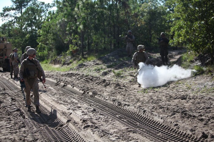 Lance Cpl. Brandon A. McNeill, a motor vehicle operator with Combat Logistics Battalion 8, 2nd Marine Logistics Group, gets hit by a simulated improvised explosive device during a field training exercise aboard Camp Lejeune, N.C., Aug. 1, 2012. The troops underwent multiple scenarios from firefights to explosions during the week-long exercise, which was part of the unit’s pre-deployment training.  The battalion is scheduled to deploy to Afghanistan in the upcoming months. 