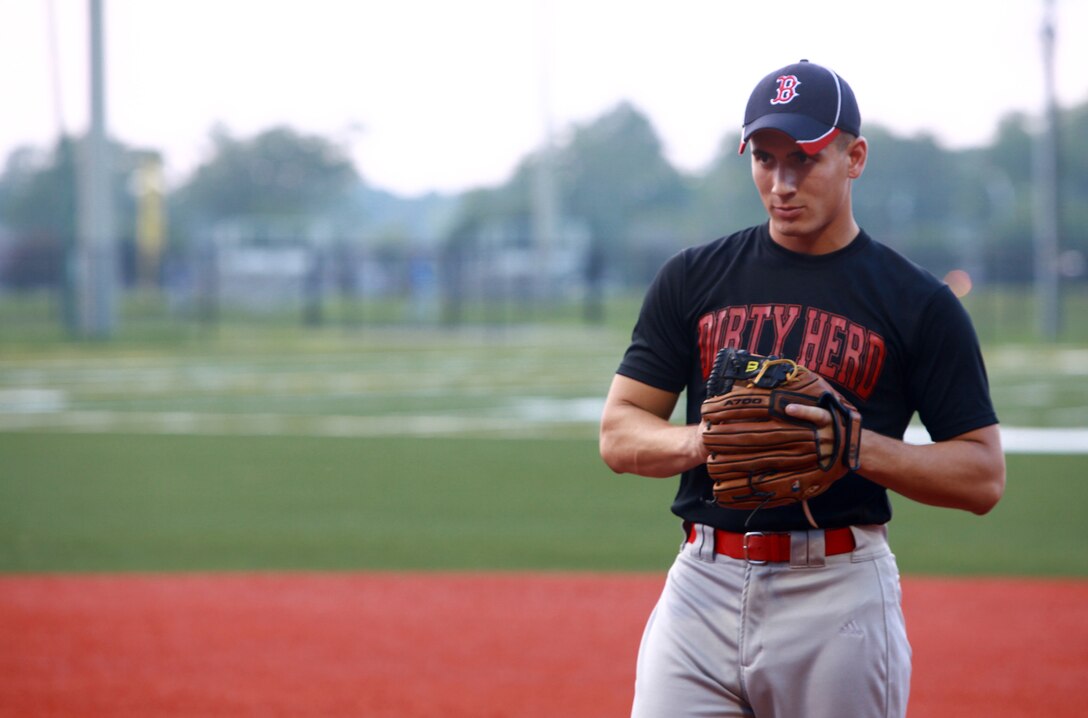 Lance Cpl. Erik Rivera, a towed artillery systems technician with Combat Logistics Regiment 2, 2nd Marine Logistics Group, gets ready to pitch during a softball game aboard Camp Lejeune, N.C., Aug. 2, 2012. Most Marines playing in the softball league are on their respective units’ teams. The league has been an ideal way for Marines to boost morale and camaraderie amongst themselves. (U.S. Marine Corps photo by Sgt. Rachael K. A. Moore)