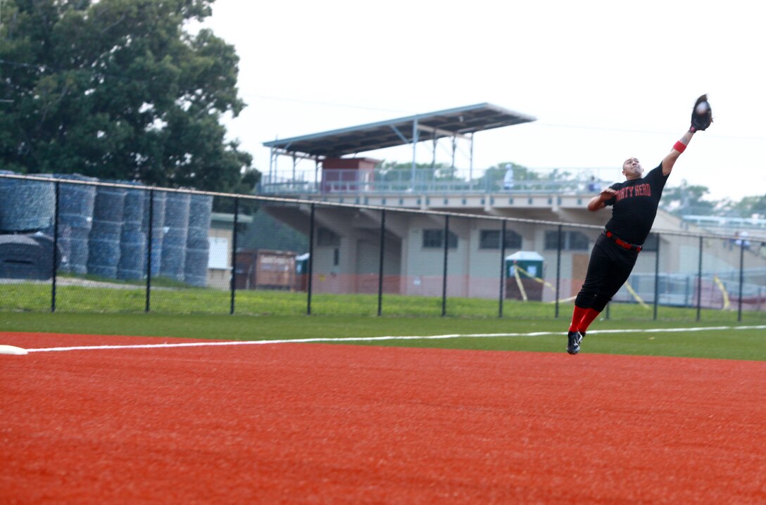 Lance Cpl. Justin Summerfield, a Marine with Combat Logistics Regiment 2, 2nd Marine Logistics Group, catches a line drive during a softball game aboard Camp Lejeune, N.C., Aug. 2, 2012. Intramural sports, like this softball league, are available to Lejeune-based Marines and sailors year round. (Photo by Sgt. Rachael K. A. Moore)