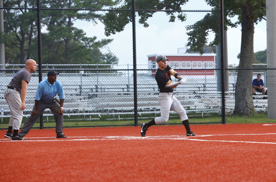 1st Lt. Jacob Ens, a logistics officer with Combat Logistics Regiment 2, 2nd Marine Logistics Group, hits a ball during a softball game aboard Camp Lejeune, N.C., Aug. 2, 2012. The softball league plays twice a week and is one of many intramural sports that are available to Marines and sailors on base. (Photo by Sgt. Rachael K. A. Moore)