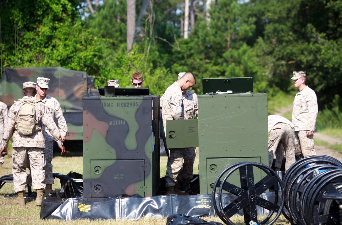 Marines with 6th Engineer Support Battalion and 8th ESB, 2nd Marine Logistics Group work on generators during a field exercise at Mile Hammock Bay aboard Camp Lejeune, N.C., July 25, 2012. During the exercise, Marines with both battalions worked together to refresh old skills and learn new techniques for upcoming deployments and training. (U.S. Marine Corps photo by Pfc. Franklin E. Mercado)