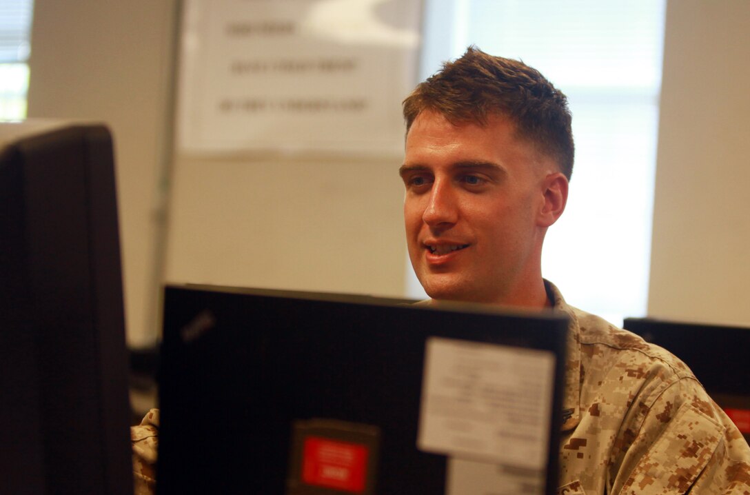 Cpl. Micheal R. McPhearson, a Marine slated to deploy with Combat Logistics Battalion 8, 2nd Marine Logistics Group, works at the battalion’s combat operations center aboard Camp Lejeune, N.C., July 24, 2012. When in a deployed environment every piece of information, statistic or happening is routed through the COC at one point or another.  (U.S. Marine Corps photo by Pfc. Franklin E. Mercado)