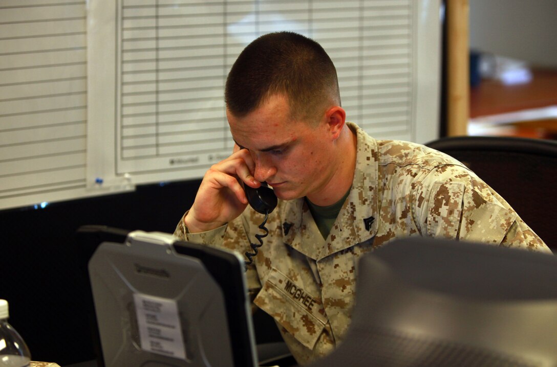Cpl. Christopher P. McGhee, a Marine with Combat Logistics Battalion 8, 2nd Marine Logistics Group, who will staff the battalion’s combat operations center during an upcoming deployment, answers the phone in the COC aboard Camp Lejeune, N.C., July 24, 2012. Marines and sailors that will be deploying with CLB-8 have been training in the unit’s COC in preparation for the group’s upcoming deployment to Afghanistan. (U.S. Marine Corps photo by Pfc. Franklin E. Mercado)