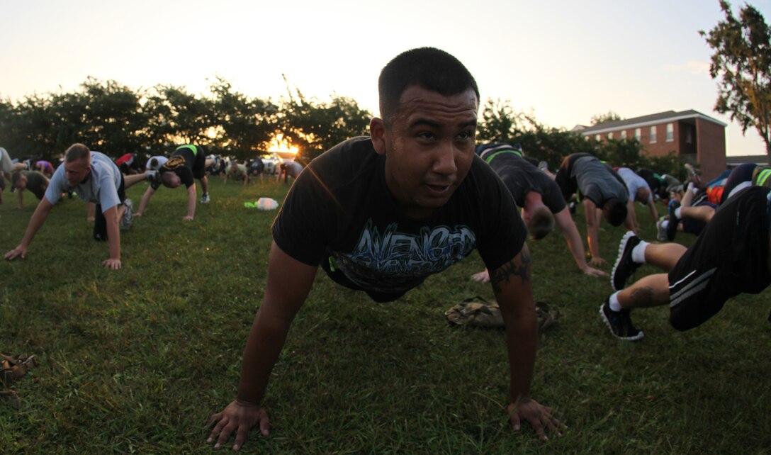 A Marine does push-ups during Headquarters and Support Battalion’s monthly physical training aboard Marine Corps Base Camp Lejeune Aug. 3. The Marine is sweating profusely after more than an hour of vigorous Semper Fit exercises. The usual three-mile battalion run was swapped for Semper Fit in order to push the Marines to different mental limits.