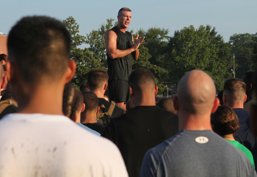 Lt. Col. David Bardorf, commander of Headquarters and Support Battalion aboard Marine Corps Base Camp Lejeune talks to the Marines after finishing the monthly battalion physical training Aug. 3. The battalion holds a PT session every month and for the second time ever the physical training consisted of Semper Fit.