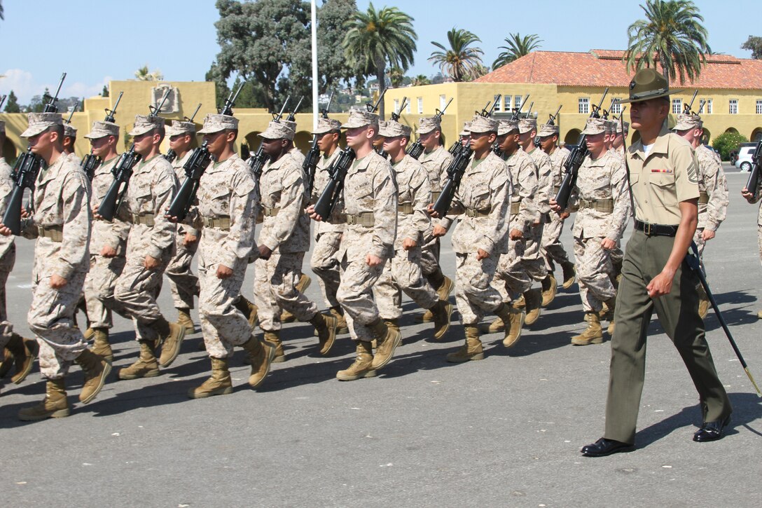 Hours after final drill Staff Sgt. Salvador Morales, senior drill instructor, Platoon 3246, Lima Company, takes his recruits back to the parade deck to practice their drill movements at Marine Corps Recruit Depot San Diego Aug. 6. It was Morales's first and last time leading final drill as senior drill instructor.