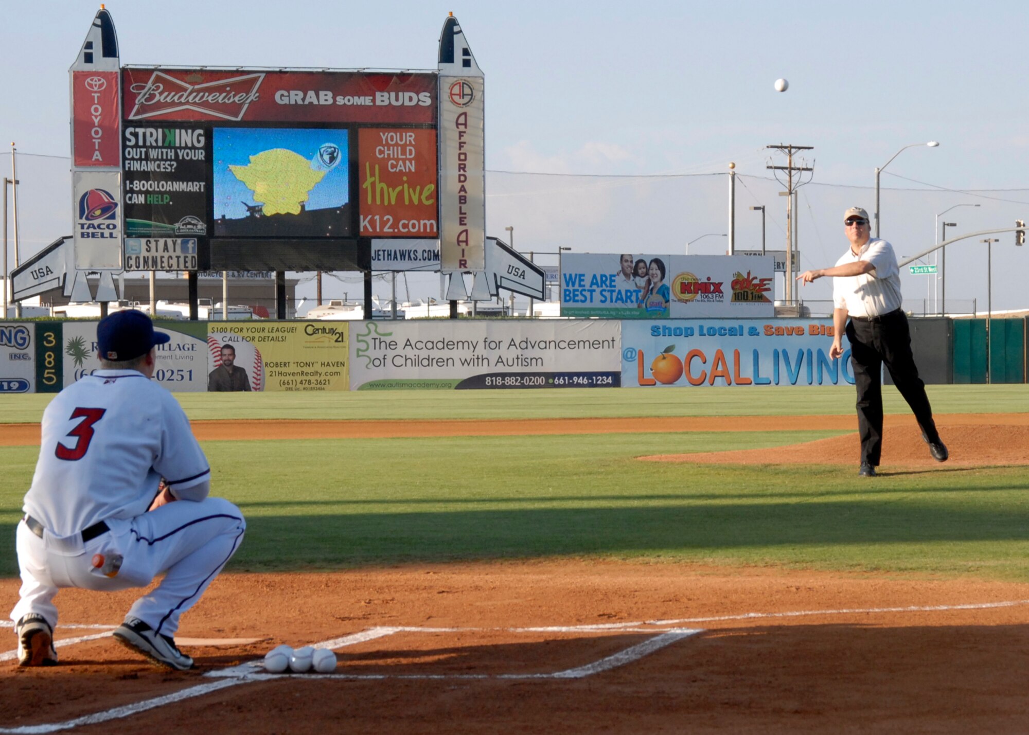 Brig. Gen. Michael T. Brewer, 412th Test Wing commander throws the ceremonial first pitch Aug. 4 in celebration of the Lancaster JetHawks' Aerospace Appreciation Night. (Air Force photo by Laura Mowry) 