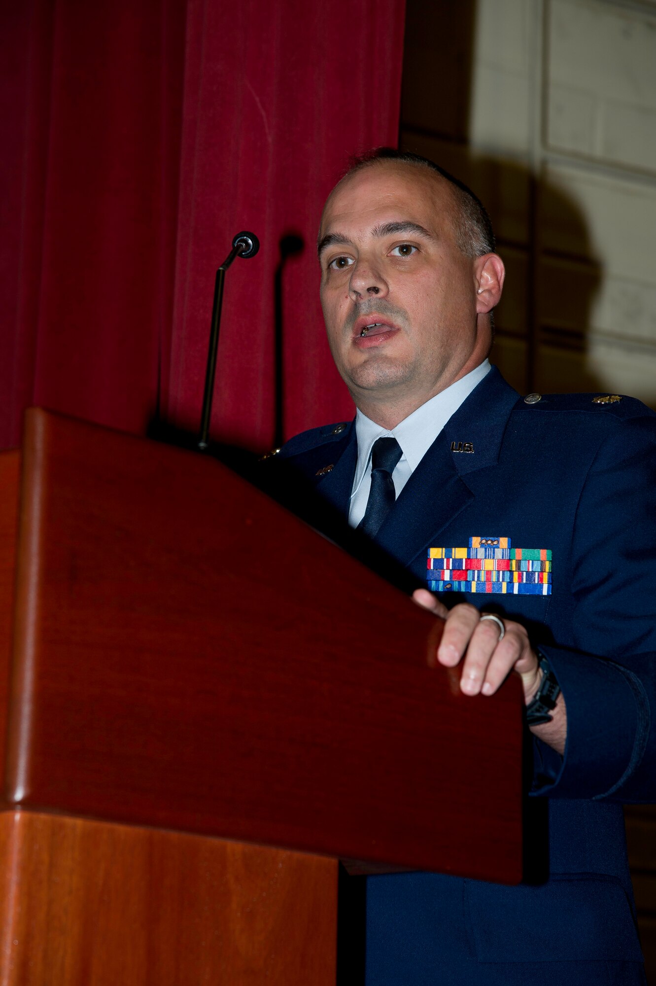 Lt. Col. Scott Minton, 912th Air Refueling Squadron incoming commander, takes command of the 912th ARS from Lt. Col. Brice Middleton, 912th ARS outgoing commander, July 21, during a change of command ceremony in the Cultural Resource Center. Col. Shawn Teagan, 92nd Operations Group commander, Fairchild AFB, Wash., presided over the event. Senior Master Sgt. Eric Butt, 912th ARS first sergeant, holds the guidon which symbolizes the transfer of authority from the old to the new commander. (U.S. Air Force photo by Staff Sgt. Matthew Smith) 