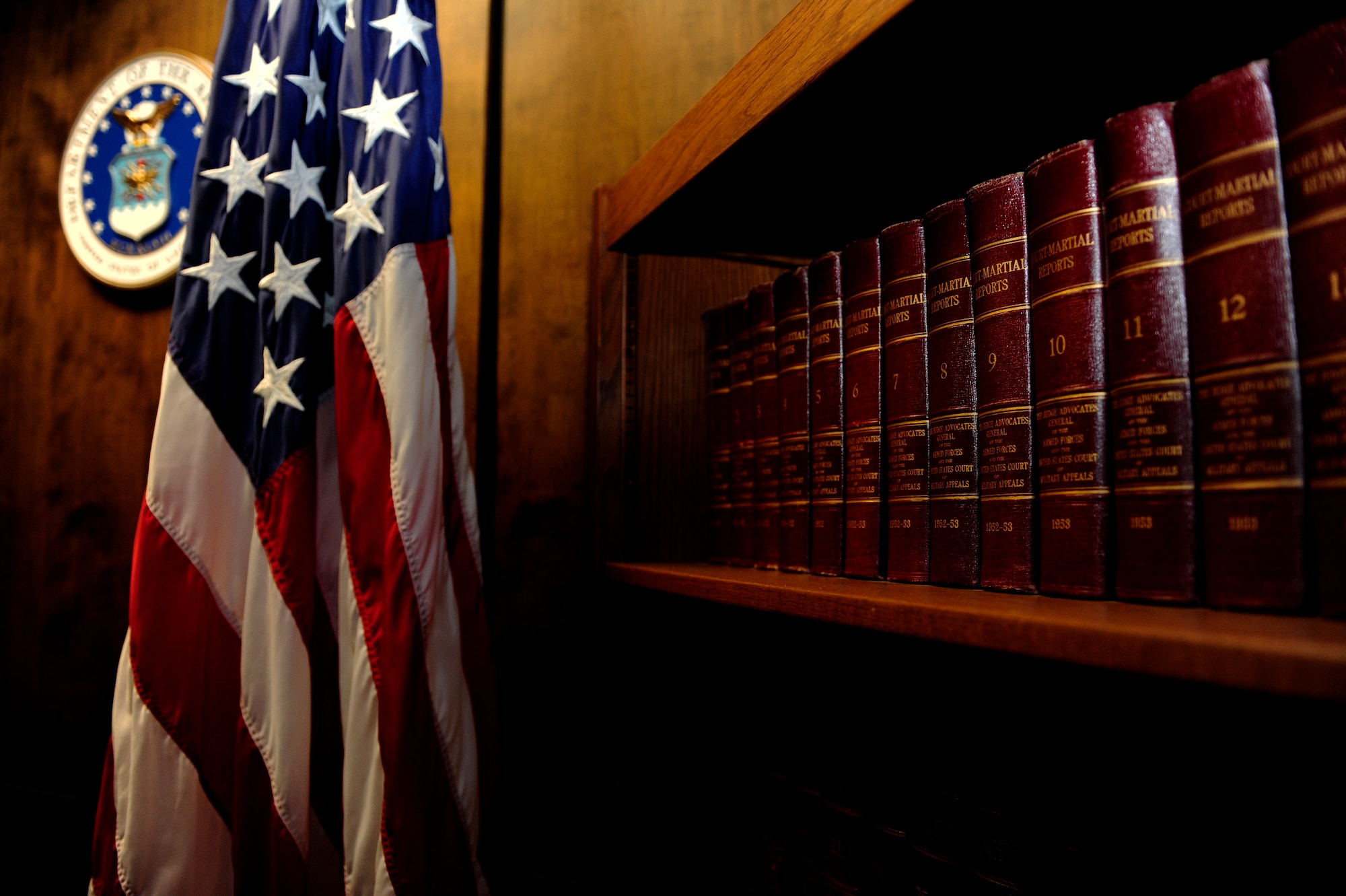 Volumes of “Court-Martial Reports” line the bookshelf located in the courtroom. These books are essential to understanding military law and court-martial cases, and also document and archive vital court-martial cases often cited as references during trials. (U.S. Air Force photo by Airman 1st Class Daniel Blackwell/Released)