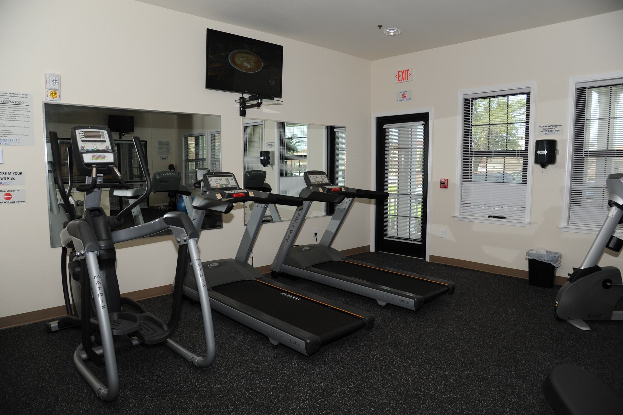 The Keesler Community Center, which is located in the Bay Ridge housing area, celebrated its opening with a ribbon-cutting ceremony and a tour of the facility August 7, 2012, at Keesler Air Force Base, Miss.  The facility features an event room, business center, fitness room with a children’s play area, an outdoor swimming pool and a splash pad.  (U.S. Air Force photo by Kemberly Groue)