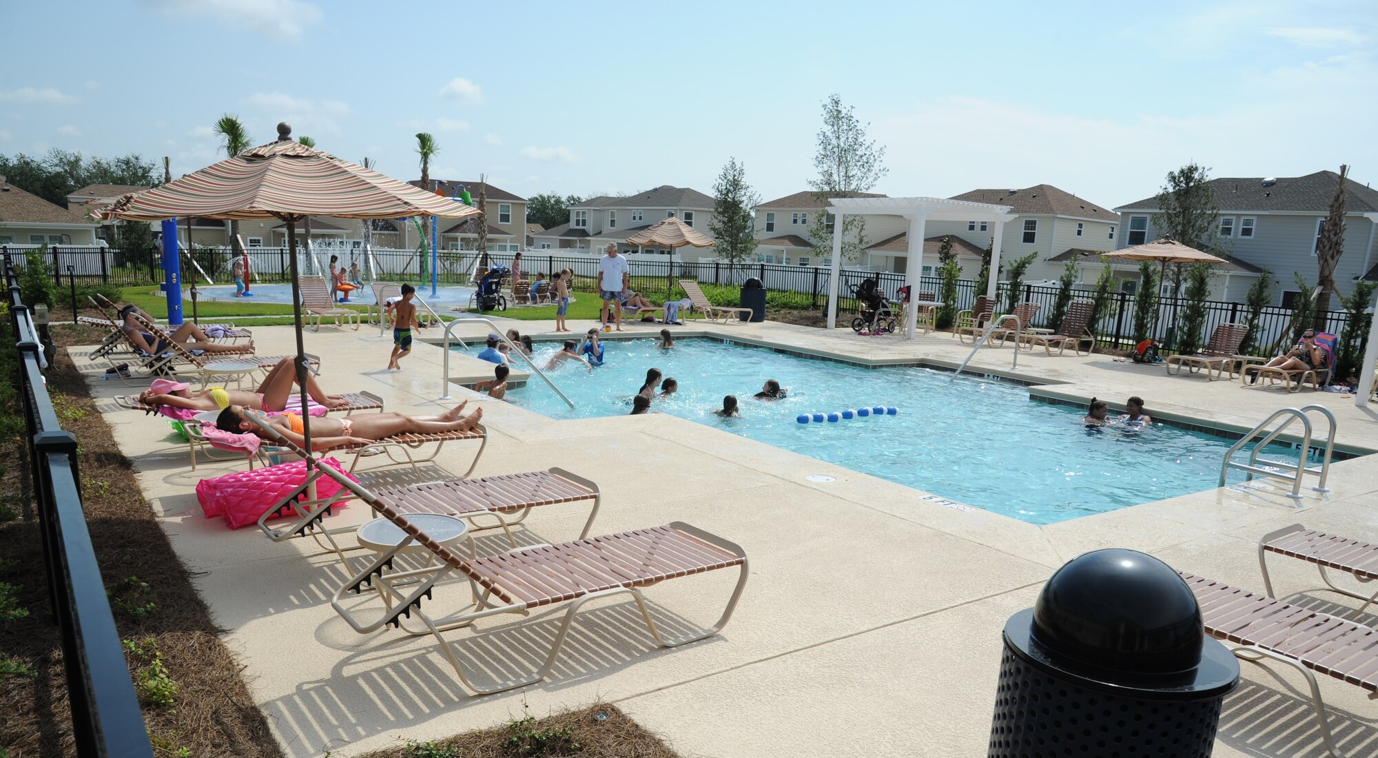 The Keesler Community Center, which is located in the Bay Ridge housing area, celebrated its opening with a ribbon-cutting ceremony and a tour of the facility August 7, 2012, at Keesler Air Force Base, Miss.  The facility features an event room, business center, fitness room with a children’s play area, an outdoor swimming pool and a splash pad.  (U.S. Air Force photo by Kemberly Groue)